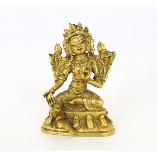 245 - * * A Tibetan miniature gilt bronze figure of Green Tara, 18th/19th century, 3cm highProvenance: G. ... 