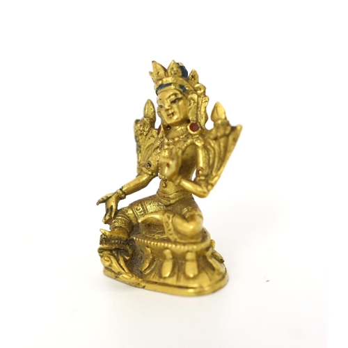 245 - * * A Tibetan miniature gilt bronze figure of Green Tara, 18th/19th century, 3cm highProvenance: G. ... 