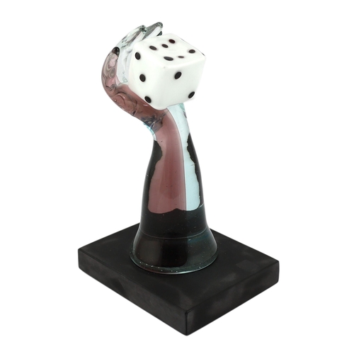 4 - ** ** A Murano Vetreria amethyst glass arm, holding a white, black spotted, dice in hand, signed, 33... 