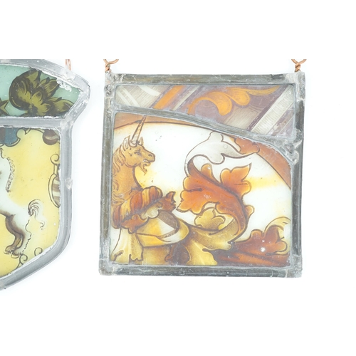 56 - Two 17th century stained glass fragment panels, each depicting a unicorn, 13 x 12cm and 14 x 10cm... 