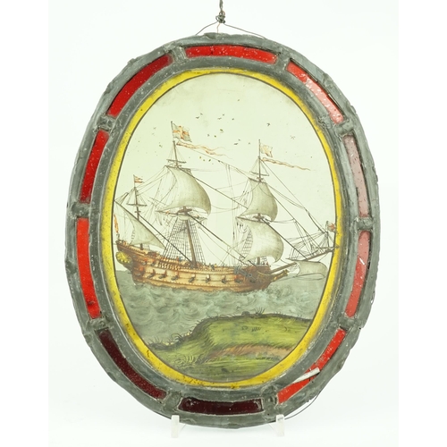 59 - An early 18th century stained glass panel, depicting a warship off the coast, within a later red gla... 