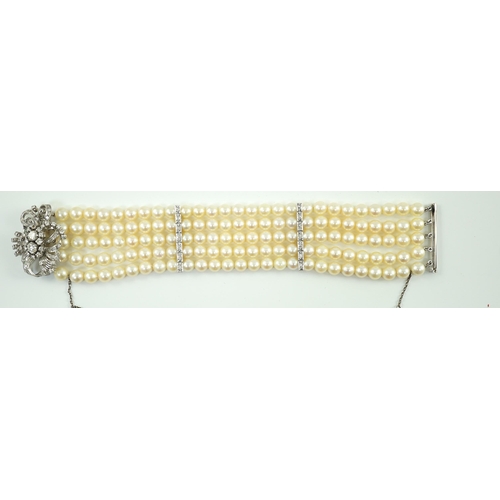 614 - A mid to late 20th century continental quintuple strand cultured pearl bracelet, with white gold and... 