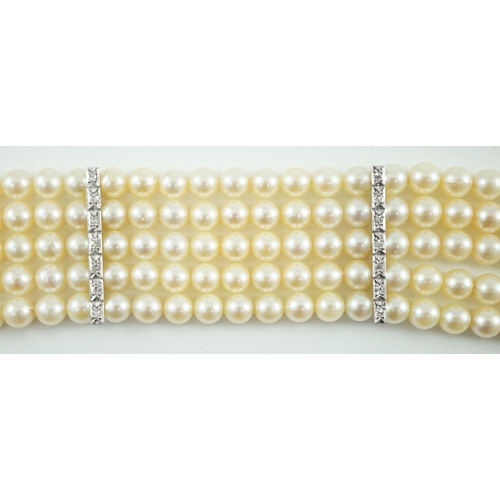 614 - A mid to late 20th century continental quintuple strand cultured pearl bracelet, with white gold and... 