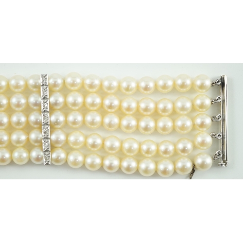 614 - A mid to late 20th century continental quintuple strand cultured pearl bracelet, with white gold and... 