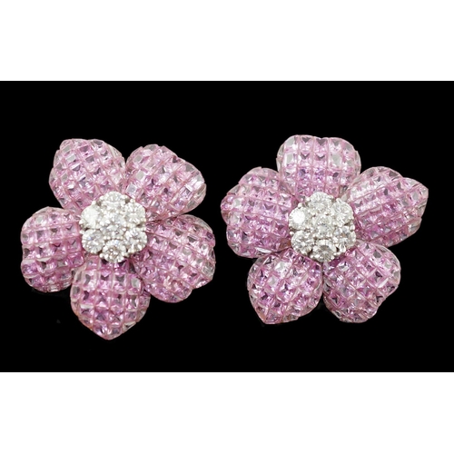 615 - A pair of 18k white gold, pink sapphire and diamond cluster set flower head ear clips/earrings, each... 