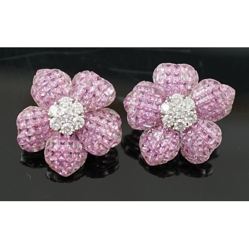 615 - A pair of 18k white gold, pink sapphire and diamond cluster set flower head ear clips/earrings, each... 