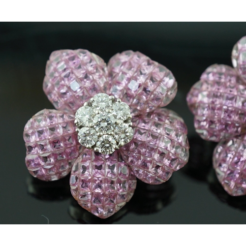 615 - A pair of 18k white gold, pink sapphire and diamond cluster set flower head ear clips/earrings, each... 