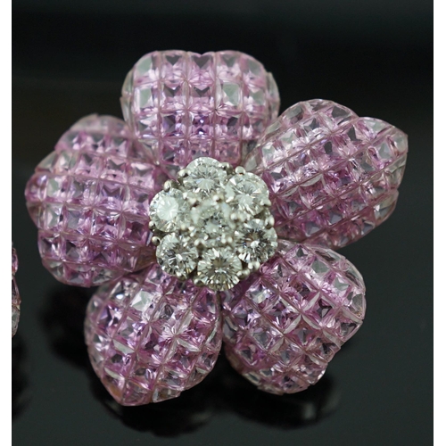 615 - A pair of 18k white gold, pink sapphire and diamond cluster set flower head ear clips/earrings, each... 