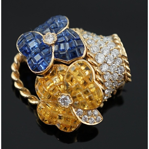 616 - A Tiffany & Co 18k gold, two colour sapphire and diamond cluster set brooch, modelled as a basket wi... 