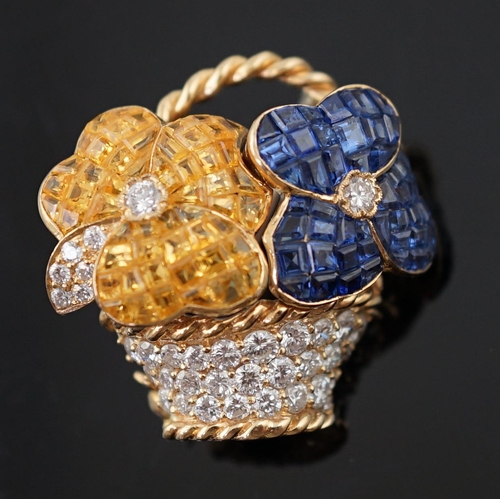 616 - A Tiffany & Co 18k gold, two colour sapphire and diamond cluster set brooch, modelled as a basket wi... 