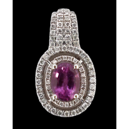 619 - A modern 14ct white gold, pink sapphire and diamond set oval cluster pendant, with four row diamond ... 