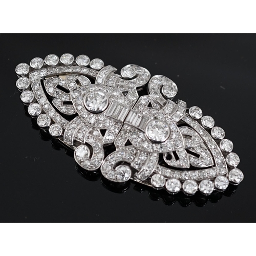 620 - An Art Deco white gold, round and baguette cut diamond set double clip brooch, the largest stones wi... 