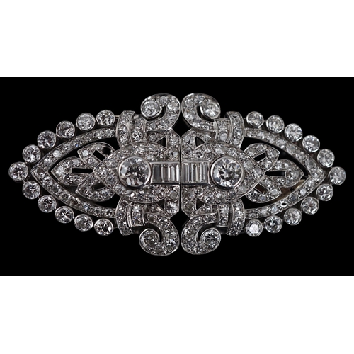 620 - An Art Deco white gold, round and baguette cut diamond set double clip brooch, the largest stones wi... 