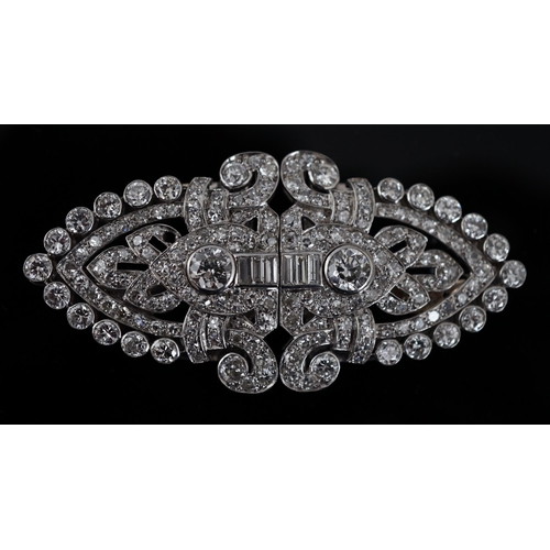 620 - An Art Deco white gold, round and baguette cut diamond set double clip brooch, the largest stones wi... 