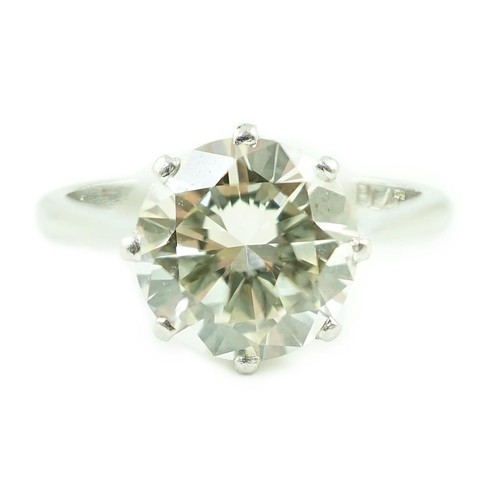 623 - A platinum and solitaire diamond set ring, the round cut stone weighing approximately 2.50ct, with a... 