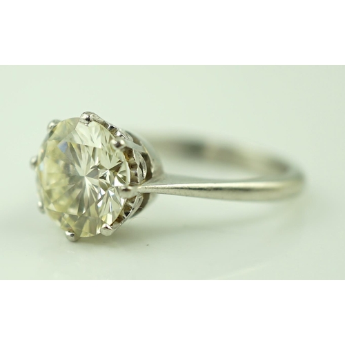 623 - A platinum and solitaire diamond set ring, the round cut stone weighing approximately 2.50ct, with a... 