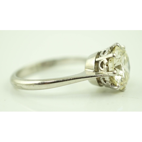 623 - A platinum and solitaire diamond set ring, the round cut stone weighing approximately 2.50ct, with a... 