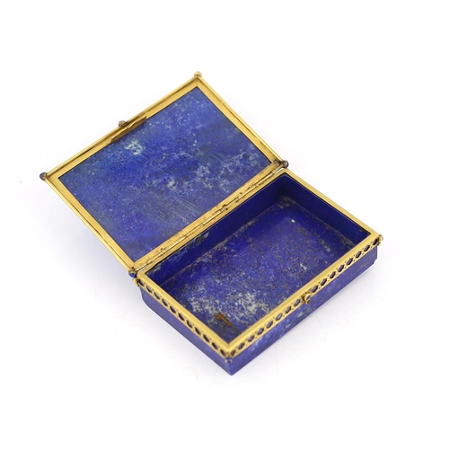 69 - A Continental gilt metal mounted lapis lazuli snuff box, c.1900, with cabochon inset mount, 9cm wide... 