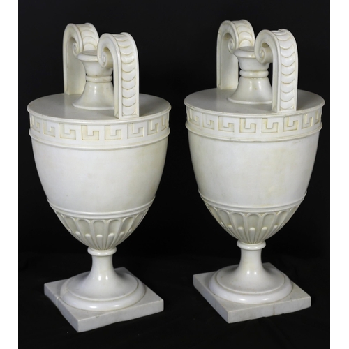 86 - * * A pair of Italian neo-classical Carrara marble vases, with scroll handles and Greek key banding,... 