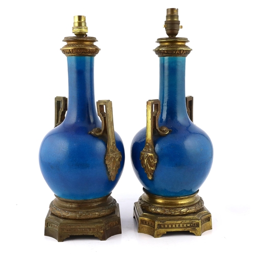 94 - A pair of Chinese or Japanese turquoise-glazed bottle vases with Louis XVI style ormolu lamp mounts,... 