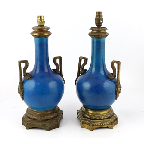 94 - A pair of Chinese or Japanese turquoise-glazed bottle vases with Louis XVI style ormolu lamp mounts,... 