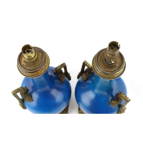 94 - A pair of Chinese or Japanese turquoise-glazed bottle vases with Louis XVI style ormolu lamp mounts,... 