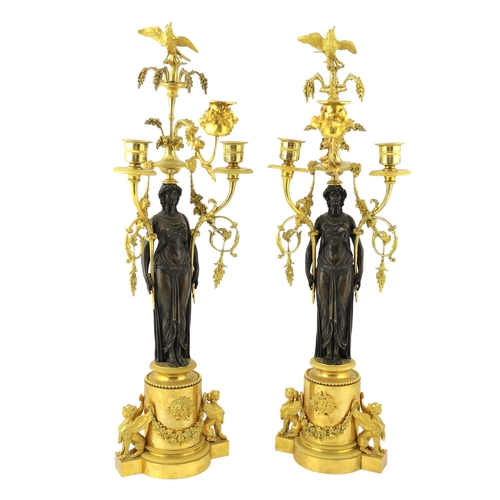 97 - * * A pair of late 19th century French Empire style bronze and ormolu three light candelabra, with b... 