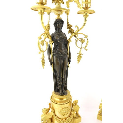 97 - * * A pair of late 19th century French Empire style bronze and ormolu three light candelabra, with b... 