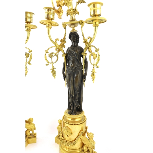 97 - * * A pair of late 19th century French Empire style bronze and ormolu three light candelabra, with b... 