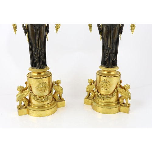 97 - * * A pair of late 19th century French Empire style bronze and ormolu three light candelabra, with b... 