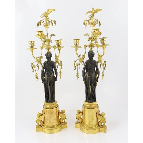 97 - * * A pair of late 19th century French Empire style bronze and ormolu three light candelabra, with b... 