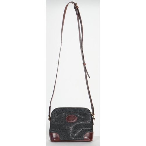 1002 - A Mulberry crossbody bag, pebble grained black leather with brown leather corner reinforcement contr... 