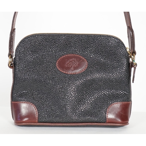 1002 - A Mulberry crossbody bag, pebble grained black leather with brown leather corner reinforcement contr... 