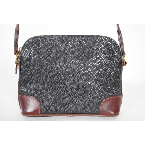 1002 - A Mulberry crossbody bag, pebble grained black leather with brown leather corner reinforcement contr... 