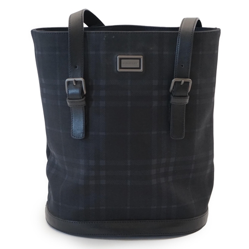 1004 - A Burberry bucket bag in blue black tartan canvas and leather, pewter coloured metalware, with dust ... 