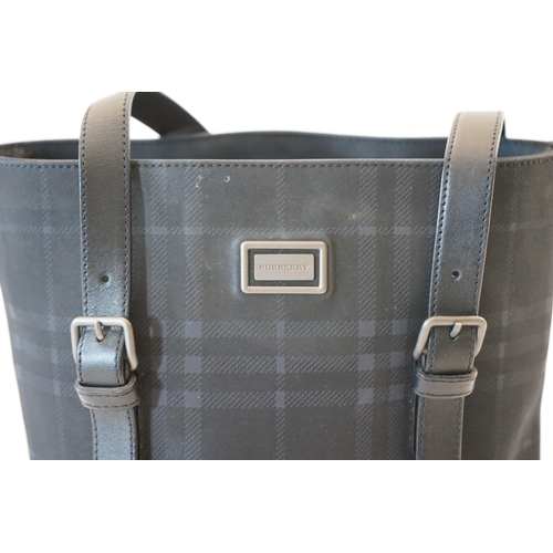 1004 - A Burberry bucket bag in blue black tartan canvas and leather, pewter coloured metalware, with dust ... 