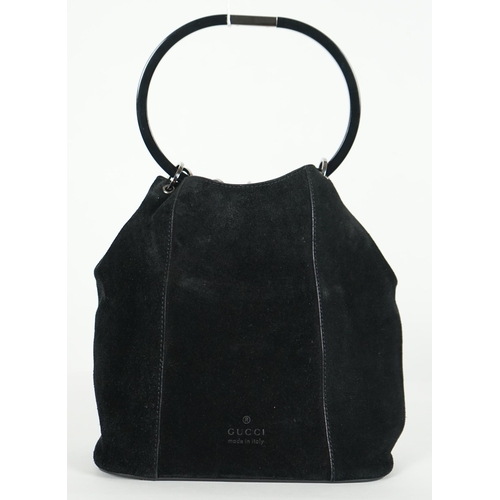 1005 - ** ** A vintage Gucci black Tom Ford era suede handbag, with dust bag, silver-tone hardware, a singl... 