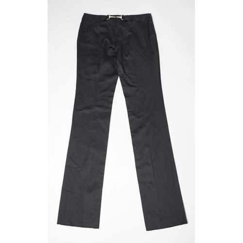 1016 - A pair of Gucci lady's textured satin trousers with gold tone diamante snaffle detail to the back an... 