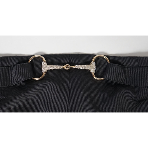 1016 - A pair of Gucci lady's textured satin trousers with gold tone diamante snaffle detail to the back an... 