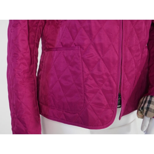 1017 - Two Burberry lady's quilted jackets, one pink and the other green, size Medium