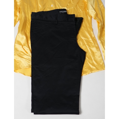 1018 - A lady's Dolce & Gabbana yellow silk blouse and a pair of black satin jeans. Blouse size 44 Trousers... 