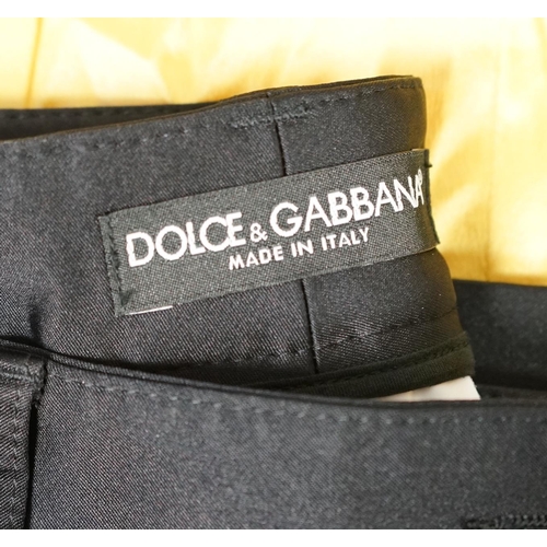 1018 - A lady's Dolce & Gabbana yellow silk blouse and a pair of black satin jeans. Blouse size 44 Trousers... 