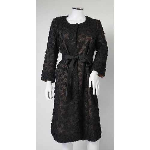 1019 - A Nicole Farhi lady's black lace knee length jacket with flower embellishment all over with black ri... 