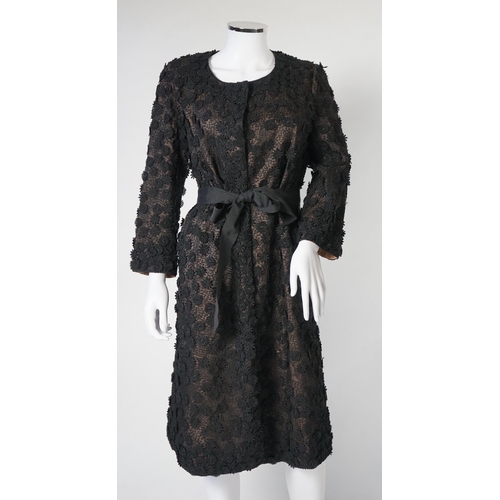 1019 - A Nicole Farhi lady's black lace knee length jacket with flower embellishment all over with black ri... 