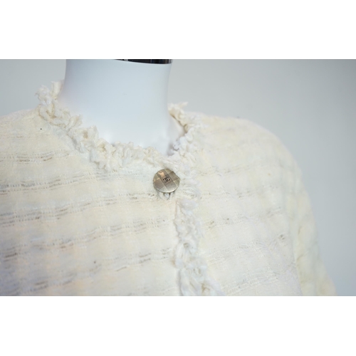 1026 - A Chanel early 1990's cream boutique jacket, with fringing to all edges, single CC silver-tone butto... 