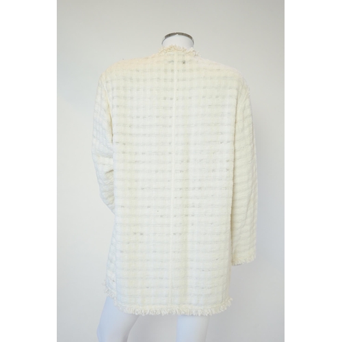 1026 - A Chanel early 1990's cream boutique jacket, with fringing to all edges, single CC silver-tone butto... 