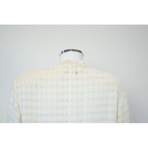 1026 - A Chanel early 1990's cream boutique jacket, with fringing to all edges, single CC silver-tone butto... 