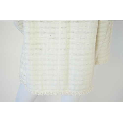 1026 - A Chanel early 1990's cream boutique jacket, with fringing to all edges, single CC silver-tone butto... 