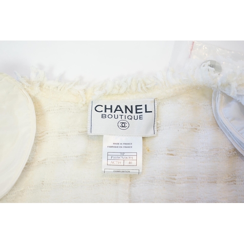 1026 - A Chanel early 1990's cream boutique jacket, with fringing to all edges, single CC silver-tone butto... 