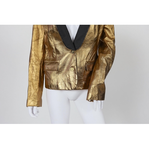 1030 - A lady's Dolce & Gabbana gold metallic leather jacket, with black lapels and leopard print lining, s... 